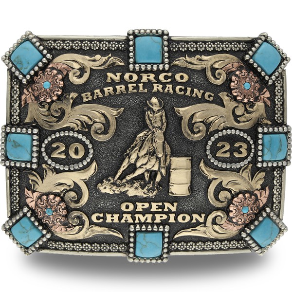 A custom women's rodeo belt buckle for Norco Barrel Racing Open Champion featuring turquoise stones and a barrel racer cowgirl figure